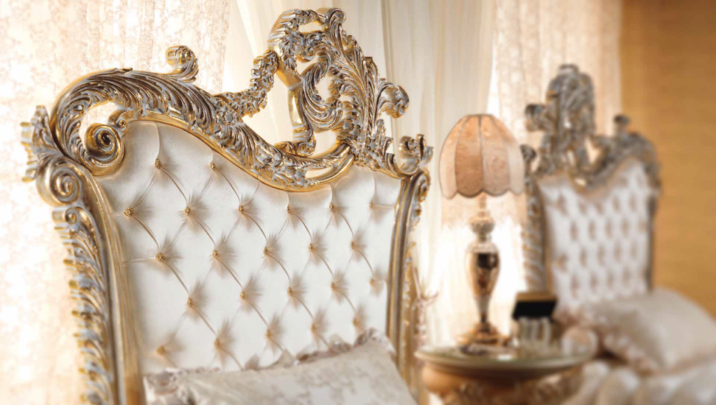 Close up of the gold engraving on a bed by Aida Collection